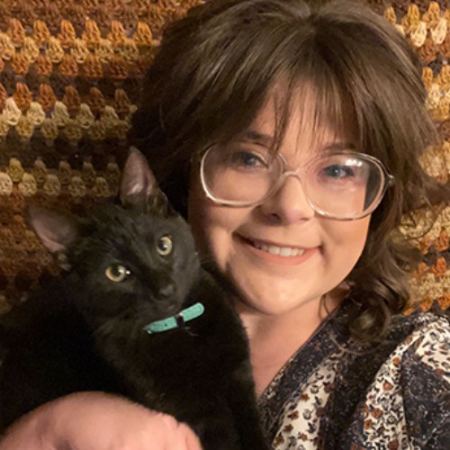 Vet staff holding a puppy